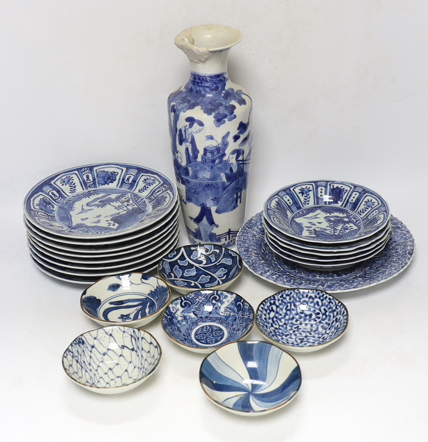 A group of Chinese blue and white dishes and plates and a damaged vase, 30cm